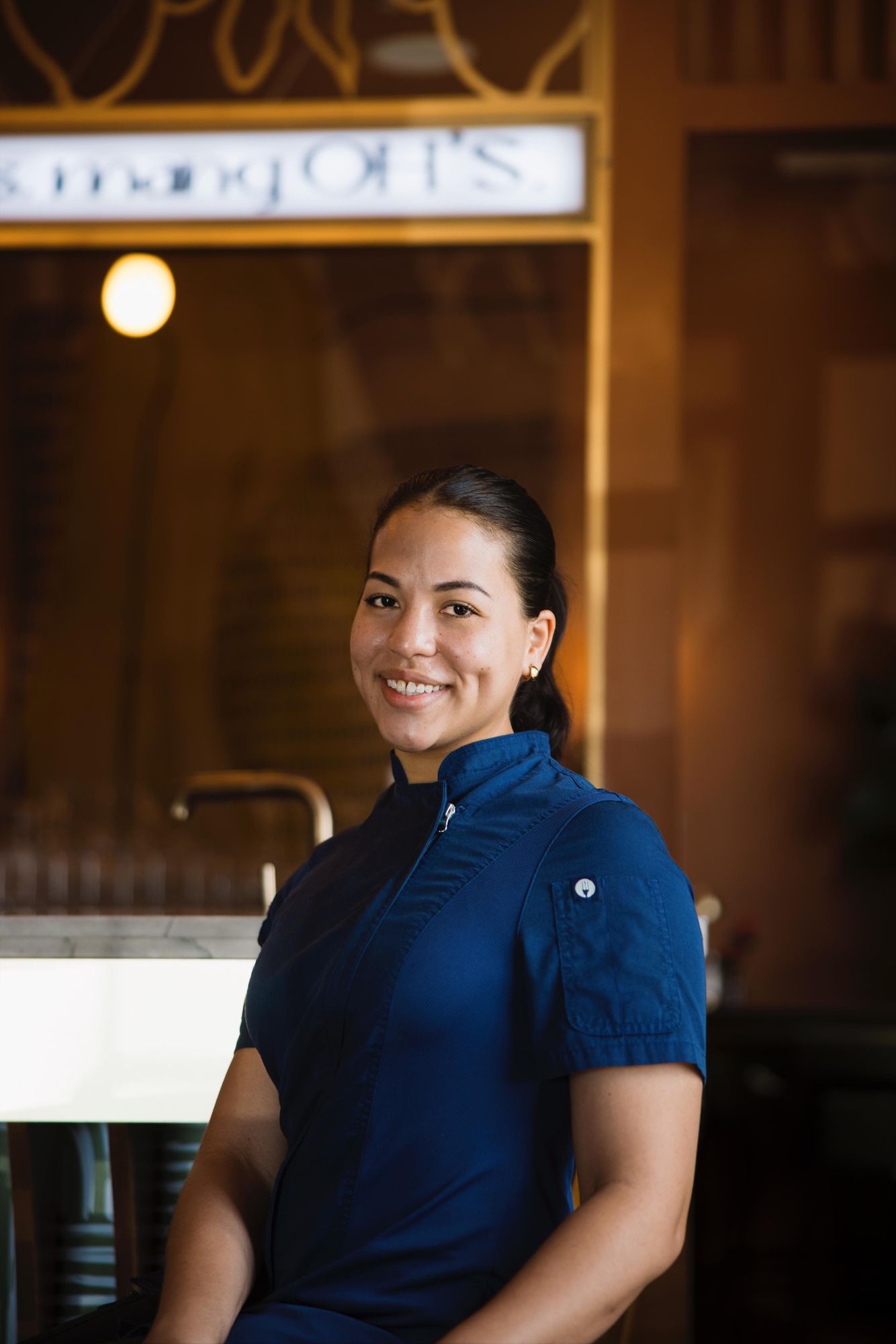 Portrait of Chef Chelsae Marie in her chef whites at Olive House